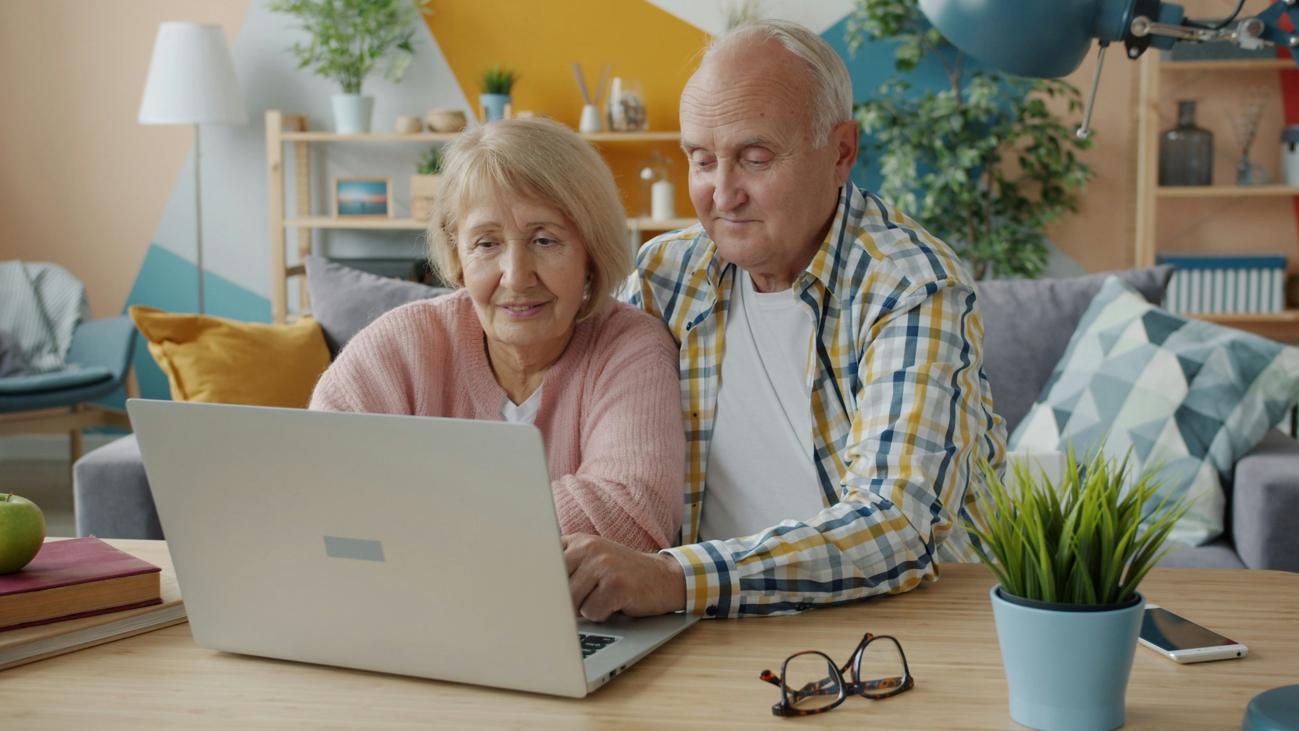 Family with laptop at home